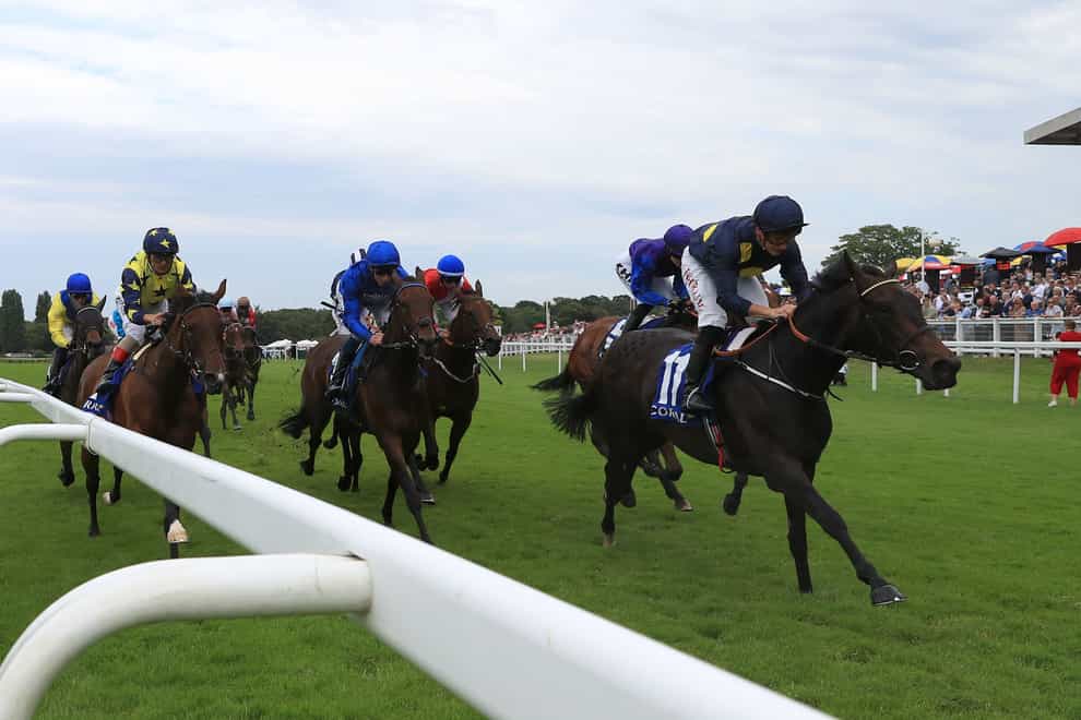Mystic Pearl and Tom Marquand coming home to win the Coral Distaff at Sandown (Bradley Collyer/PA)