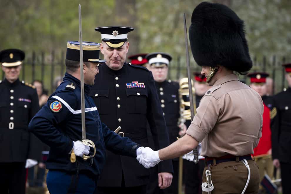 Personnel from the Gendarmerie’s Garde Republicaine and the British Army’s Scots Guards (PA)