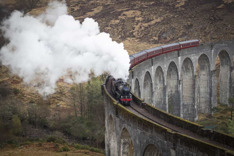 The Jacobite Express of crosses the Glenfinnan Viaduct on its way to Mallaig from Fort William (Jane Barlow/PA)