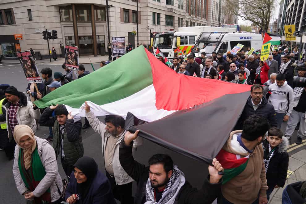 The rally has been criticised in the past after participants flew flags of the Lebanese militant Hezbollah group and brandished signs with allegedly antisemitic messages (Lucy North/PA)