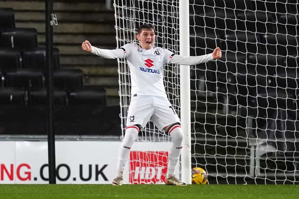 Milton Keynes Dons’ Max Dean celebrates their side’s second goal of the game, an own goal scored by AFC Wimbledon’s Ryan Johnson (not pictured) during the Sky Bet League Two match at Stadium MK, Milton Keynes. Picture date: Tuesday January 23, 2024.