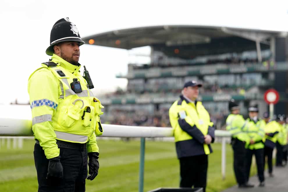 Police on patrol during Grand National day last year (Mike Egerton/PA)