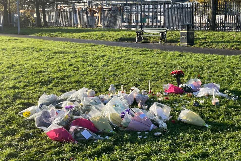 Floral tributes left at the scene at Stowlawn playing fields in Wolverhampton (PA)