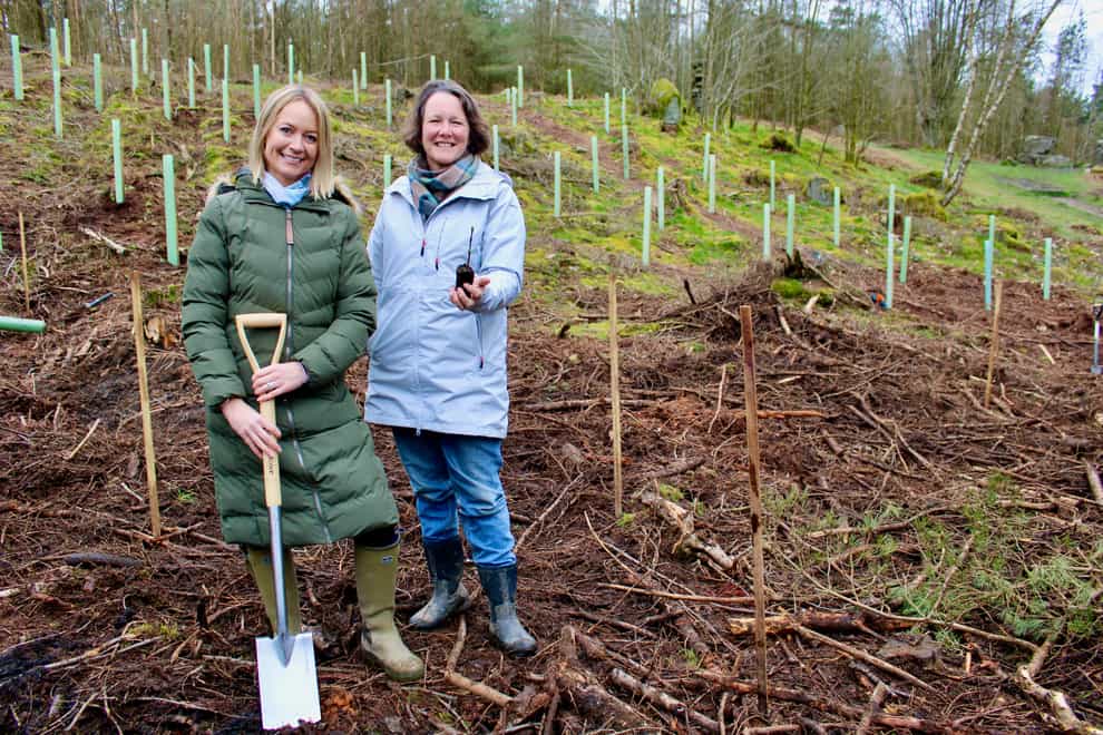 Artist Lucy Pittaway with estate owner Felicity Cunliffe-Lister at the new woodland site she has created in memory of the felled Sycamore Gap tree (Handout/PA)