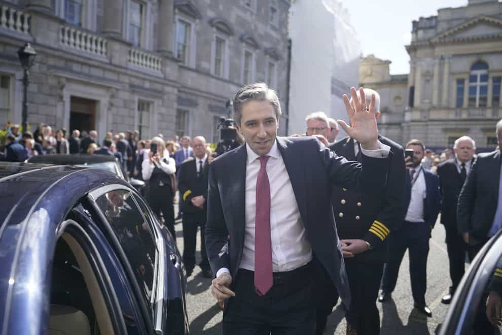 Newly elected Taoiseach Simon Harris gestures as he leaves the Dail in Dublin (Niall Carson/PA)