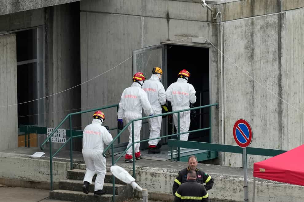 Firefighters work at the scene of an explosion that occurred at the Enel Green Power hydroelectric plant at the Suviana Dam, Bologna, Italy (Antonio Calanni/AP)
