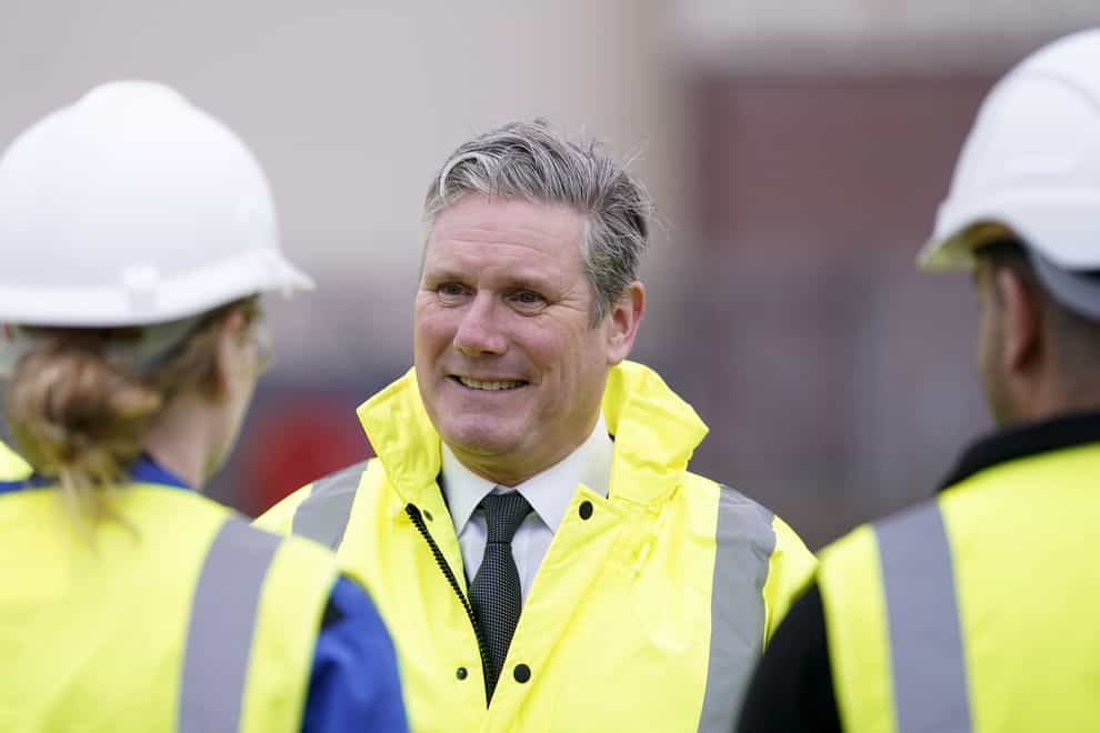 Labour Party leader Sir Keir Starmer talking to workers during a campaign visit to BAE Systems (Danny Lawson/PA)