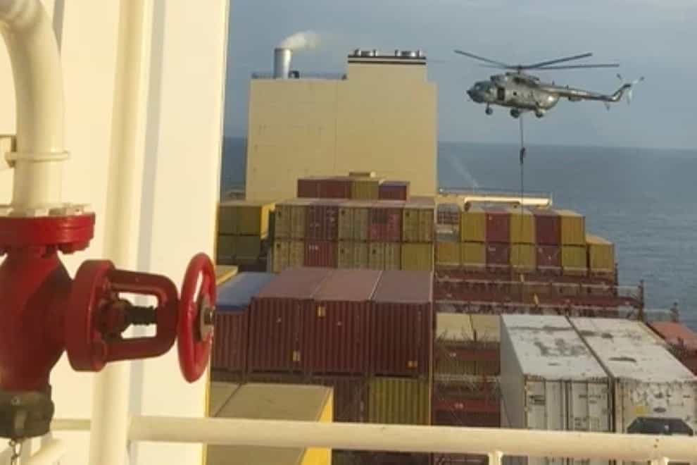 A helicopter raid targeting a vessel near the Strait of Hormuz (AP Photo)