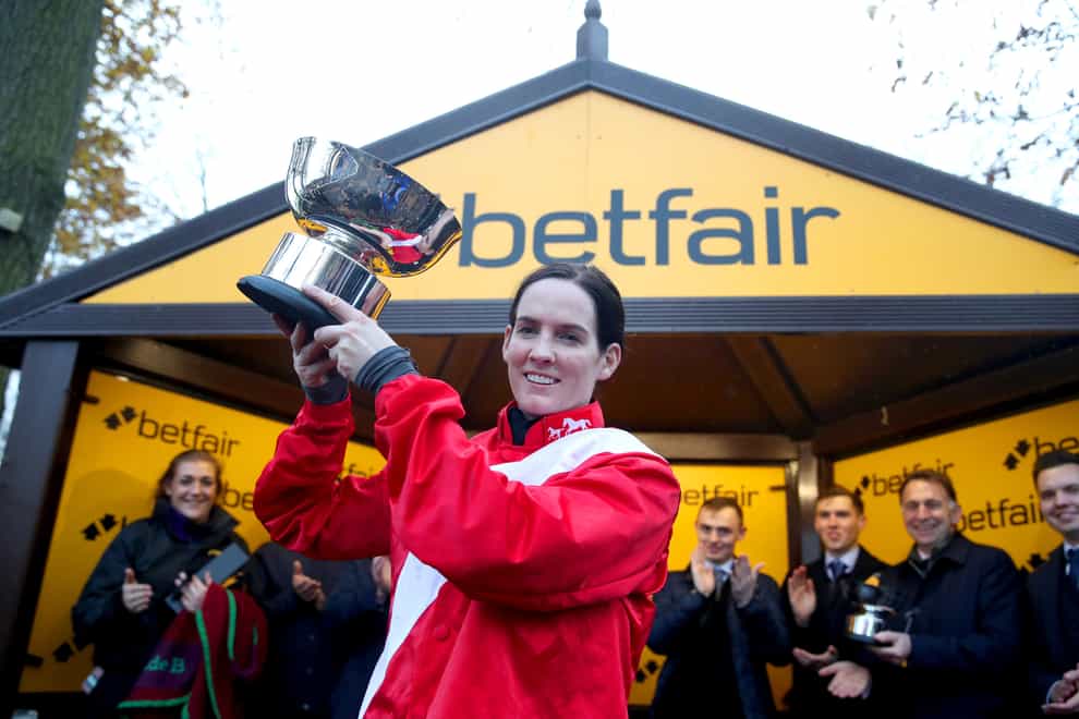 Jockey Rachael Blackmore celebrates with the trophy after winning the Betfair Chase on A Plus Tard during the Betfair Chase Day at Haydock Park Racecourse (Simon Marper/PA)