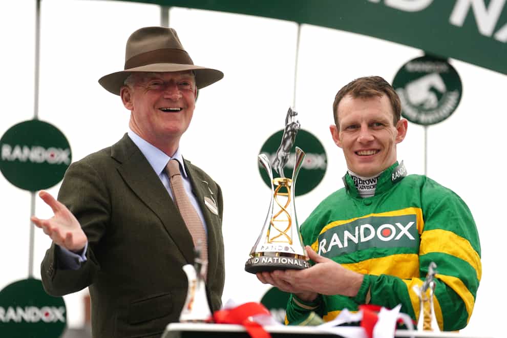 Paul Townend (right) and trainer Willie Mullins with the trophy after winning the Randox Grand National Handicap Chase with horse I Am Maximus on day three of the 2024 Randox Grand National Festival at Aintree Racecourse, Liverpool. Picture date: Saturday April 13, 2024.