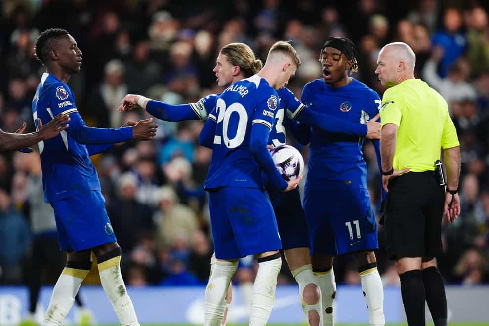 Chelsea’s Cole Palmer holds onto the ball as team-mates Nicolas Jackson and Noni Madueke argue (John Walton/PA)