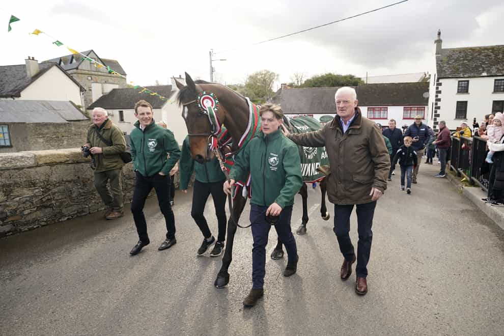 Jockey Paul Townend (left), 2024 Randox Grand National winner I Am Maximus, groom Steven Cahill and trainer Willie Mullins the homecoming parade (Niall Carson/PA)