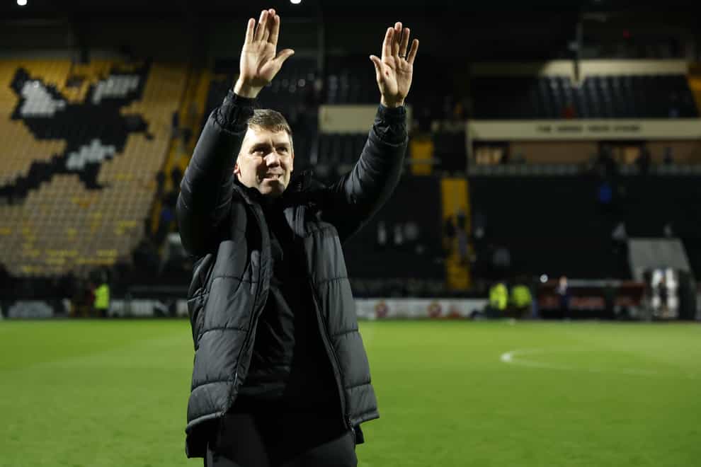 Dave Challinor salutes the Stockport fans as his team celebrates winning the League Two title (Nigel French/PA)