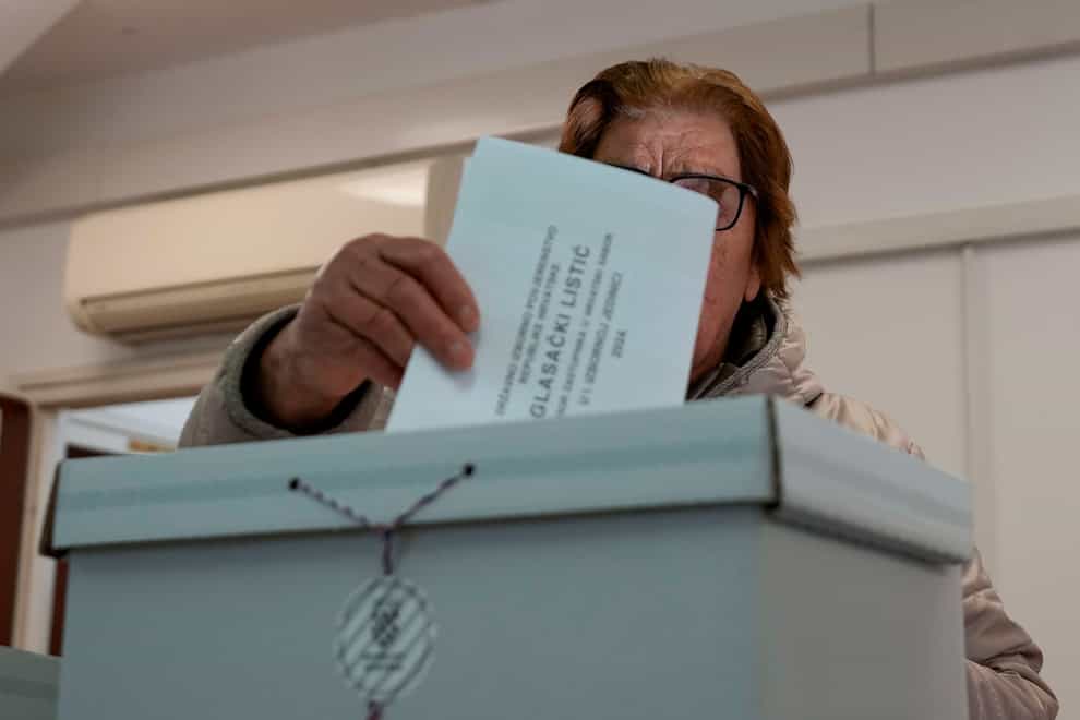 Croatians are voting in a parliamentary election following a campaign centred on a bitter rivalry between the president and prime minister (Darko Vojinovic/AP)
