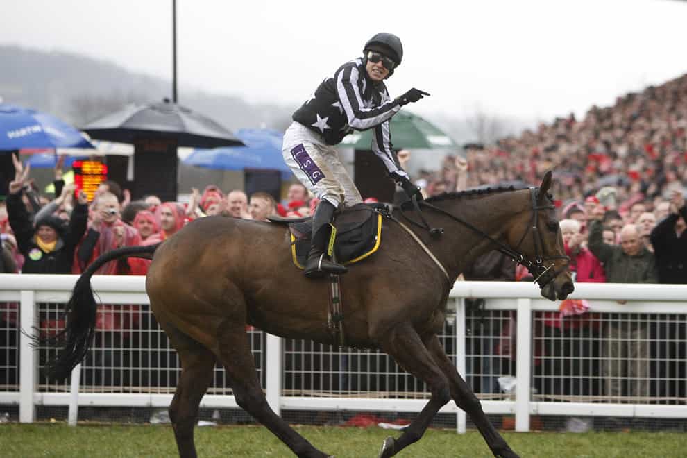 Paddy Brennan celebrates winning the 2010 Cheltenham Gold Cup on Imperial Commander (Nick Pots/PA)