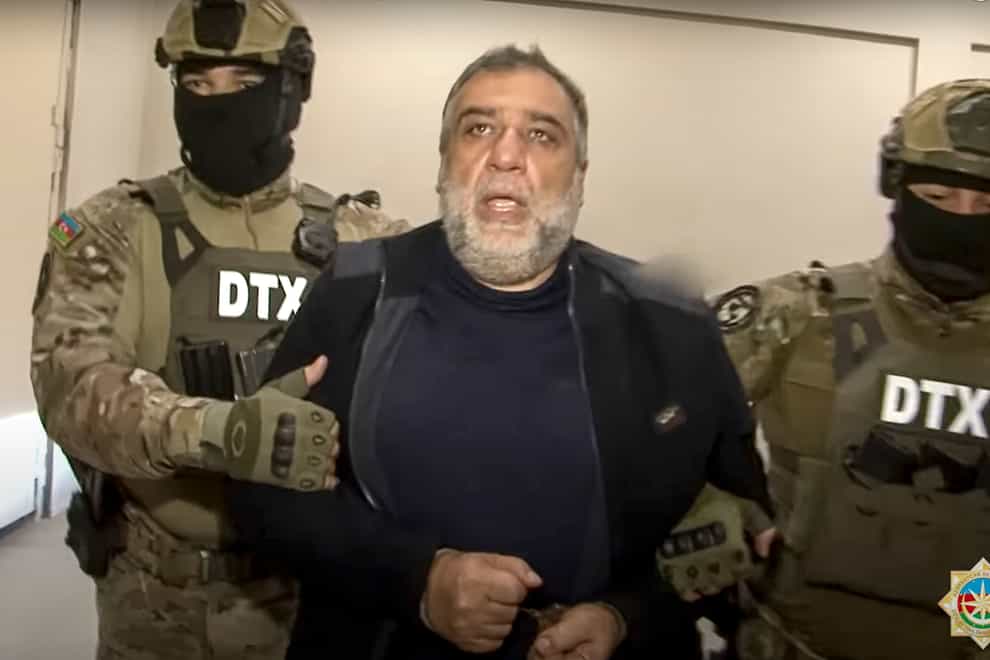 FILE – In this photo taken from video released by State Security Service of the Republic of Azerbaijan on Thursday, Sept. 28, 2023, Ruben Vardanyan, the former head of Nagorno-Karabakh’s separatist government, center, is escorted by Azerbaijani security service agents in Baku, Azerbaijan. Vardanyan, a former Ruben Vardanyan (State Security Service of the Republic of Azerbaijan via AP, File)