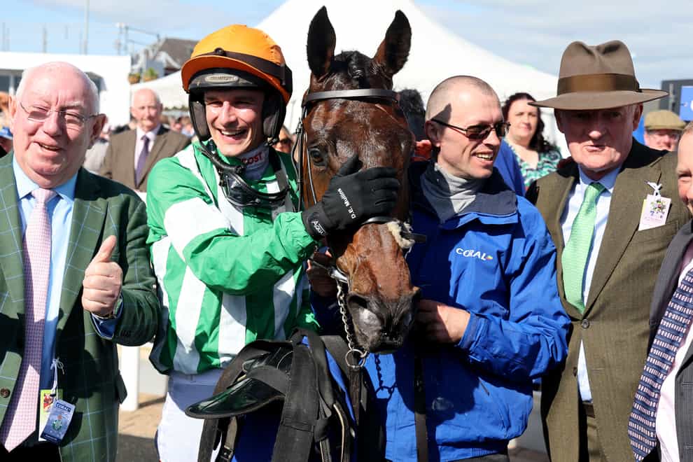Winning horse Macdermott with jockey Danny Mullins (second left) and trainer Willie Mullins (right) after winning the Coral Scottish Grand National Handicap Chase during the Coral Scottish Grand National festival at Ayr Racecourse. Picture date: Saturday April 20, 2024.