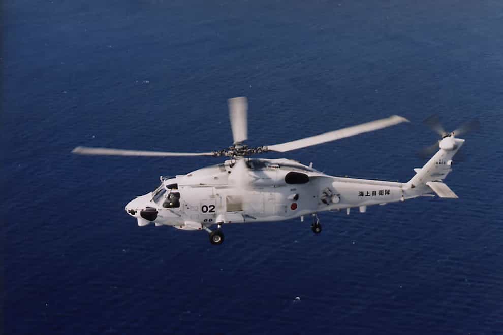 Two Japanese navy SH-60K helicopters crashed in the Pacific Ocean south of Tokyo during a night-time training flight after possibly colliding with each other, the country’s defence minister said (Japan Maritime Self-Defence Force/AP)