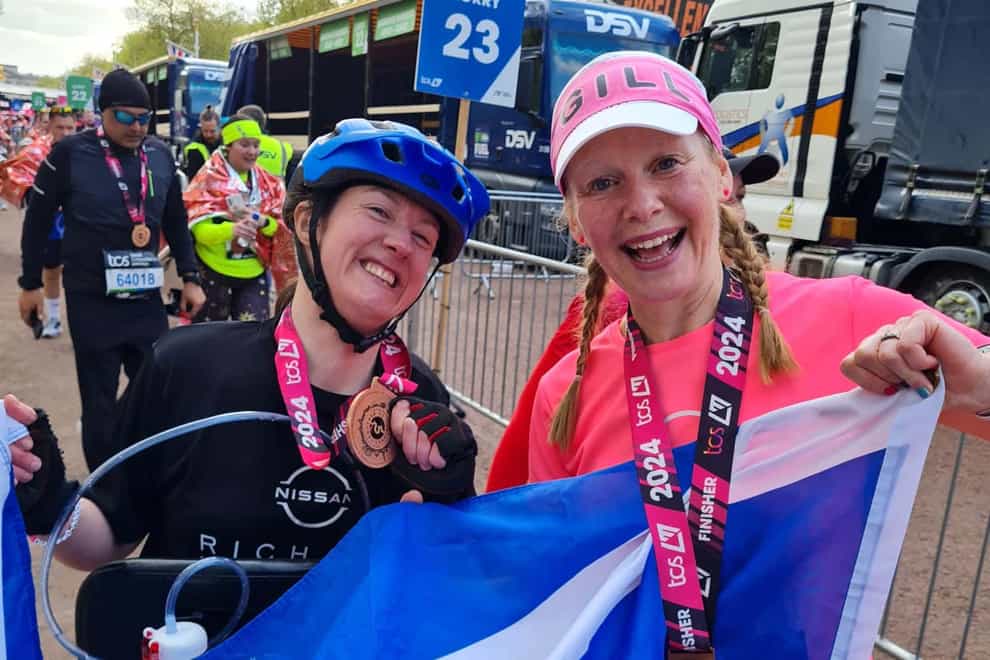 Dr Julie McElroy (left) completed the London Marathon in five hours and 59 minutes on Sunday, accompanied by her support runner Gill Menzies (right) (Gill Menzies/PA)