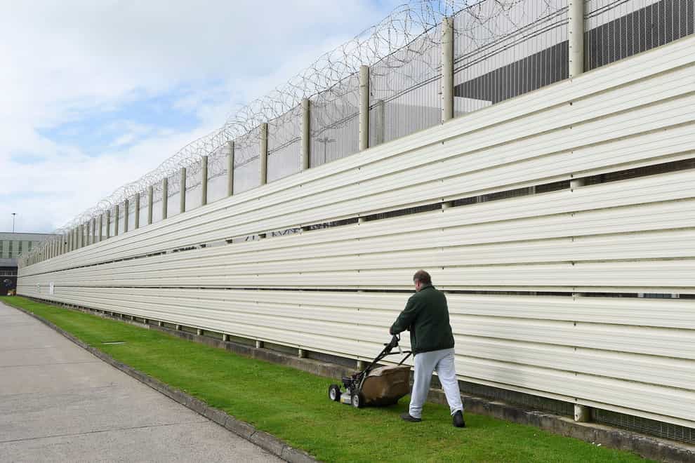 A prisoner undertaking daily maintenance work at HMP Maghaberry (PA)