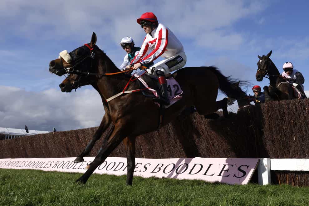 The Real Whacker leading the way in the Cheltenham Gold Cup (Steven Paston/The Jockey Club)