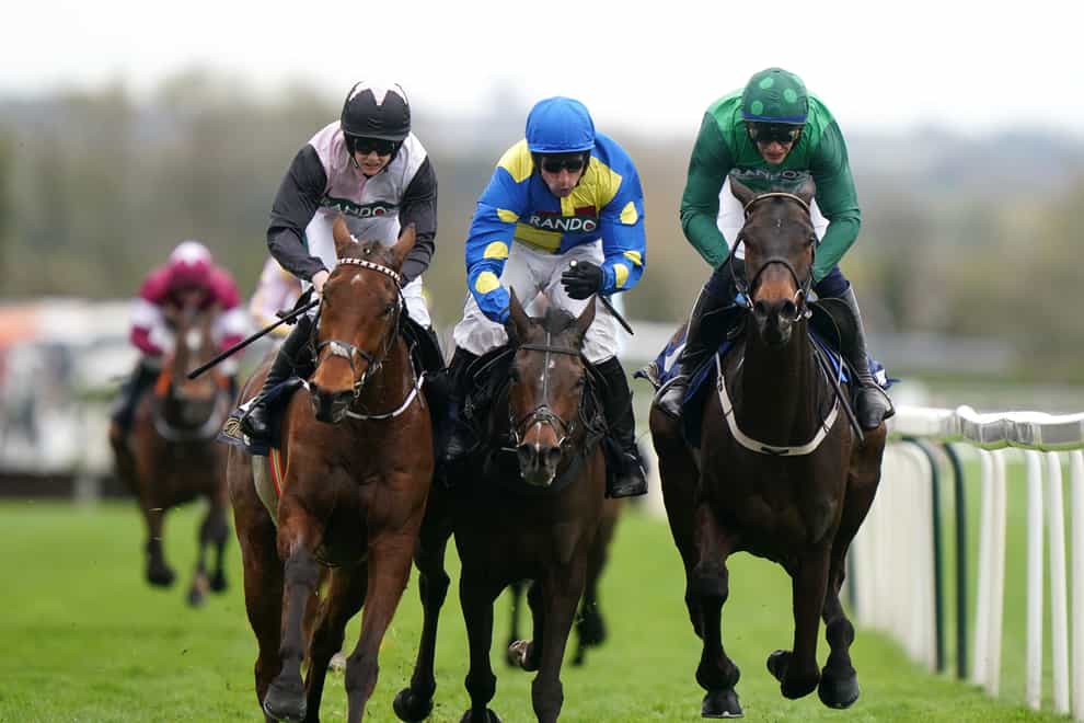 Impaire Et Passe (right), Langer Dan (centre) and Bob Olinger fight out the finish to the Aintree Hurdle (Bradley Collyer/PA)