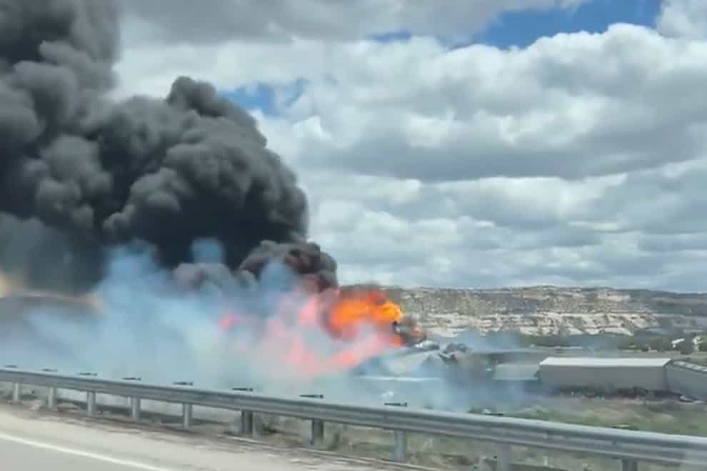 This frame grab showing a freight train carrying fuel that derailed and caught fire near the New Mexico-Arizona state line (Bryan Wilson via AP)