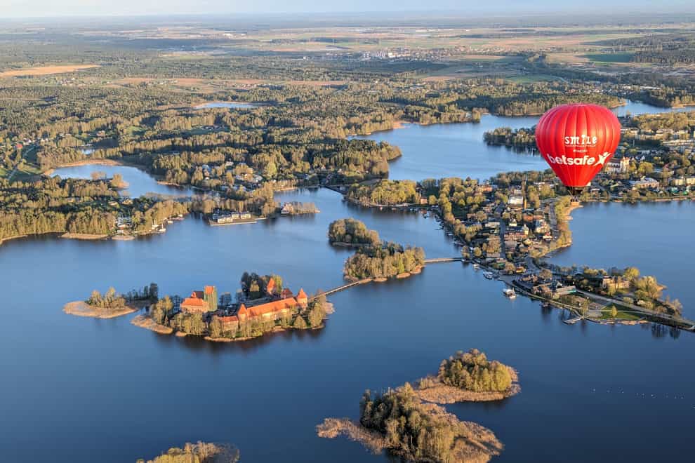 Lake Galvė is home to the fairy tale-esque Trakai Castle (Ed Elliot/PA)