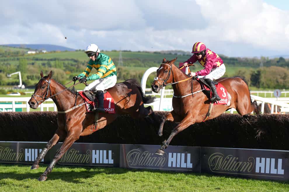 Spillane’s Tower (left) and Monty’s Star jump the final fence at Punchestown (Niall Carson/PA)