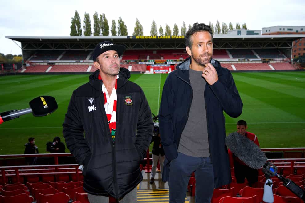 Wrexham owners Rob Elhenney (left) and Ryan Reynolds have ambitious plans to develop the ground so “the whole town could come to a game” (Peter Byrne/PA)