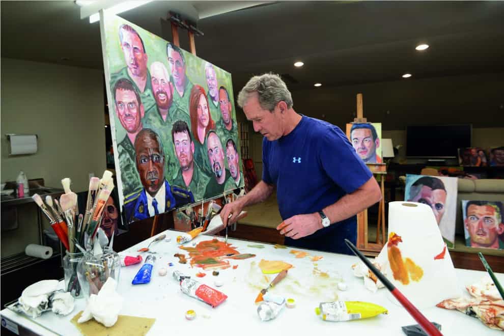 Former president George W Bush working on a portrait of service members and veterans (George W Bush Presidential Centre via AP)