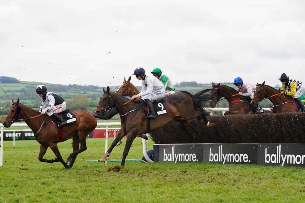Minella Crooner ridden by Sam Ewing (left) on the way to winning at Punchestown (Brian Lawless/PA)