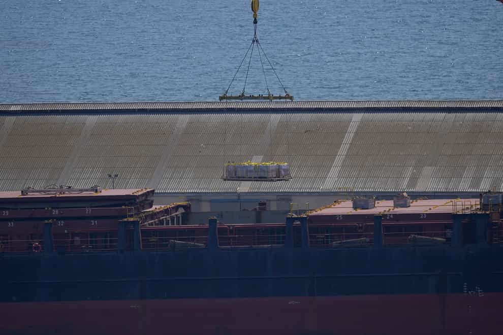 A crane loads food aid for Gaza onto the container ship Sagamore docked at Larnaca port, Cyprus (Petros Karadjias/AP)
