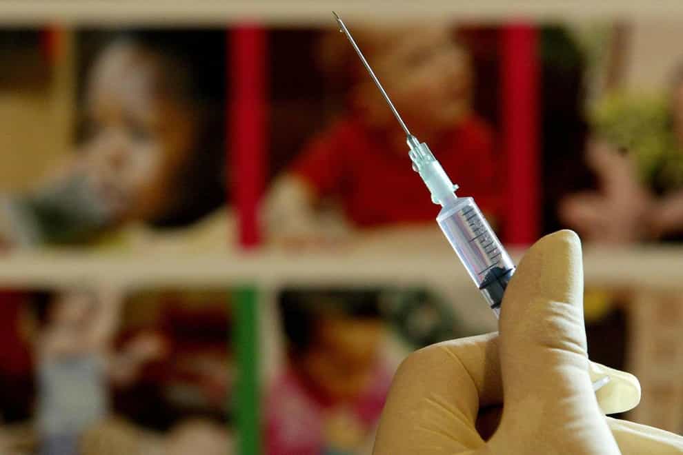 A nurse handles a syringe at a medical centre (PA)