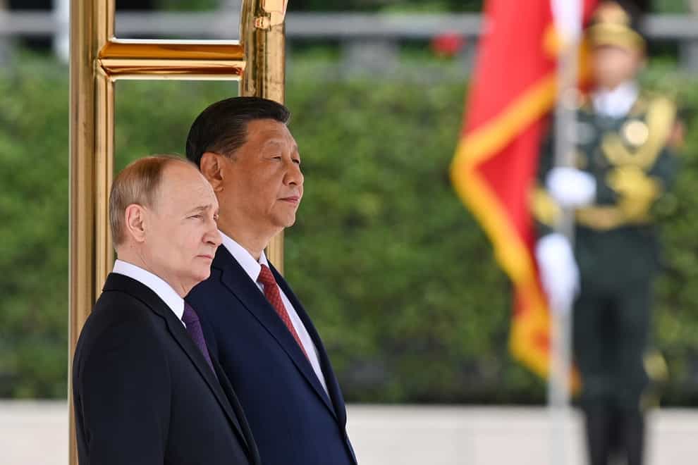 Chinese President Xi Jinping and Russian President Vladimir Putin attend an official welcome ceremony in Beijing (Sergei Bobylev, Sputnik, Kremlin Pool Photo via AP)